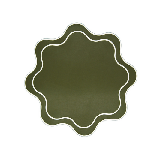 A round dark green faux leather placemat with a textured surface and white detailed trim.