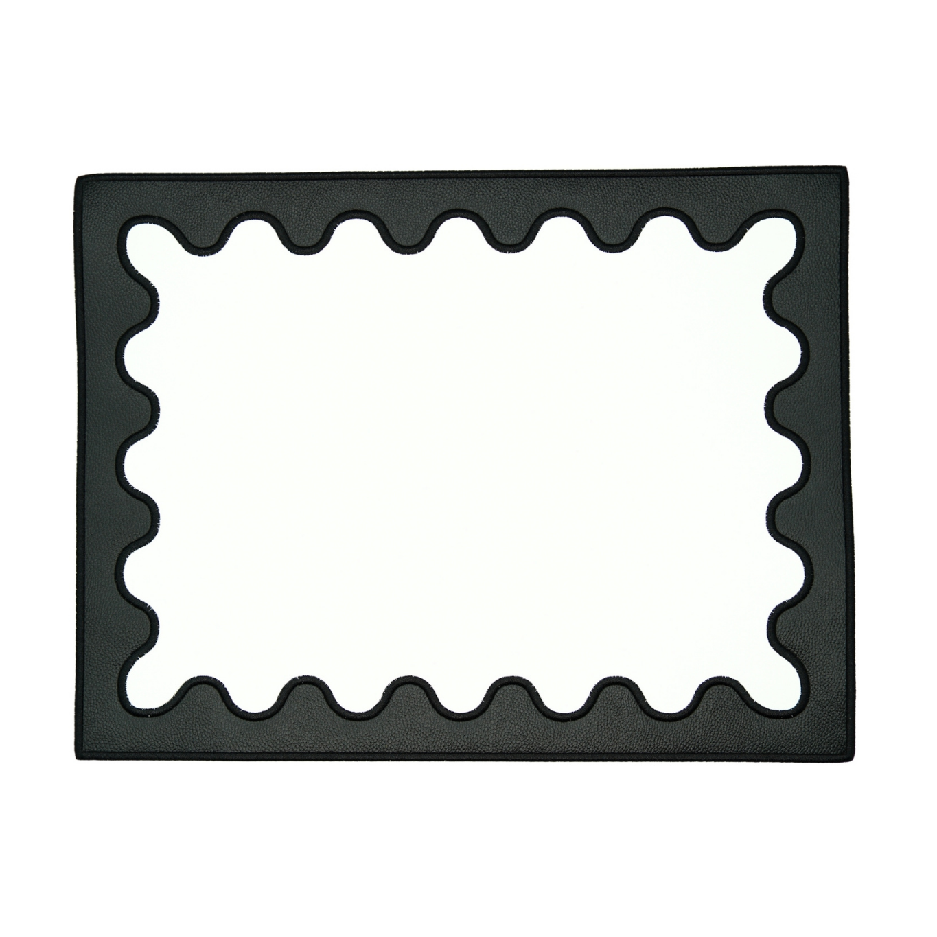 A rectangular black faux leather placemat with a decorative embroidered border.