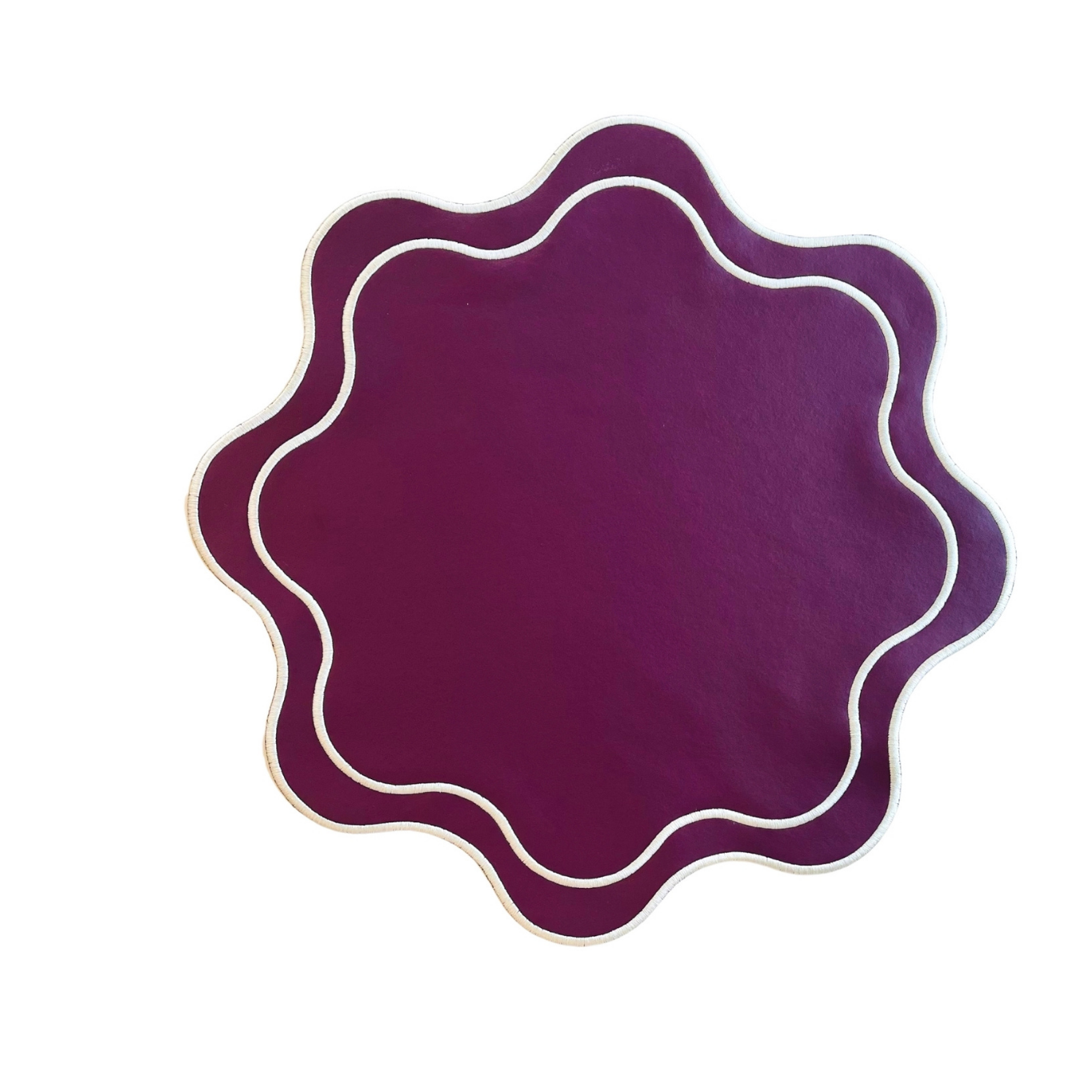 A round, burgundy faux leather placemat with a textured surface and decorative white stitching around the edge.