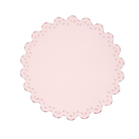 A round pink faux leather placemat with a scalloped edge design.