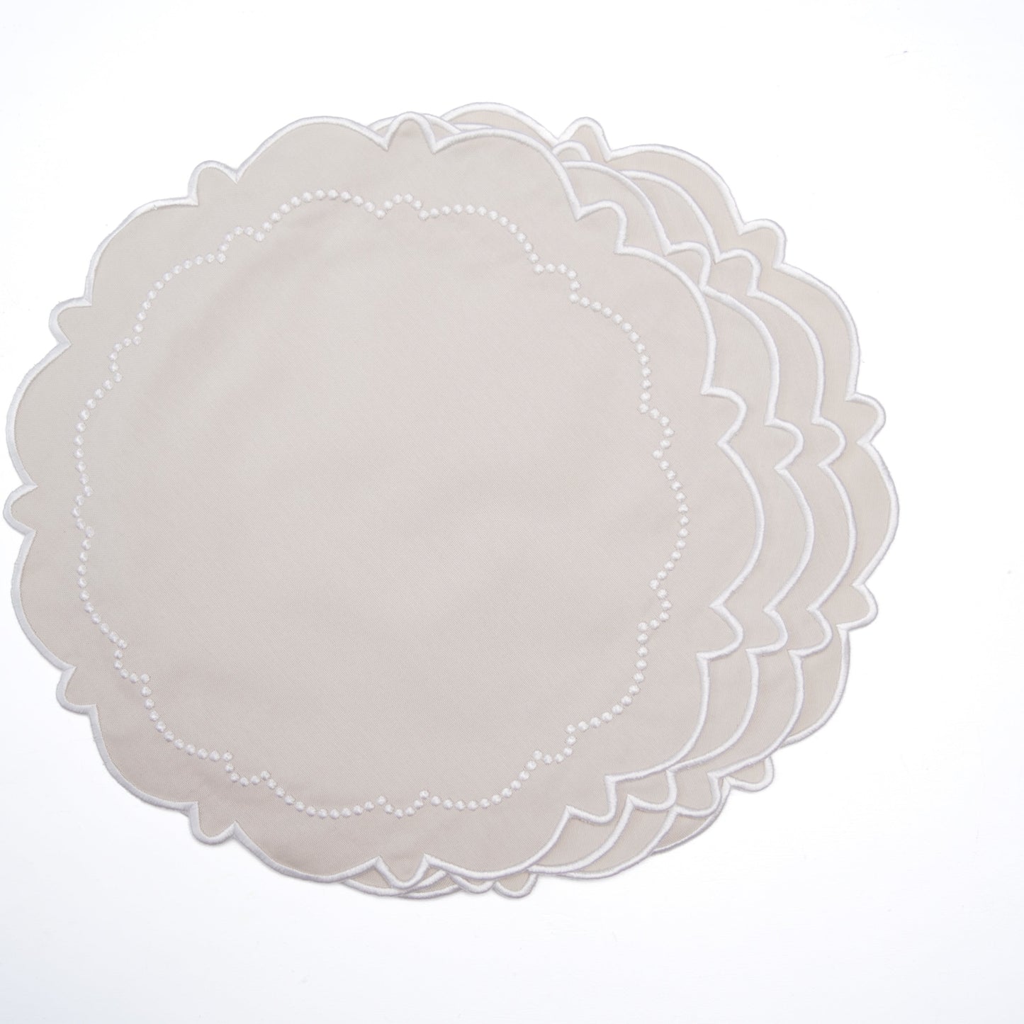 Set of white doily placemats on a white background