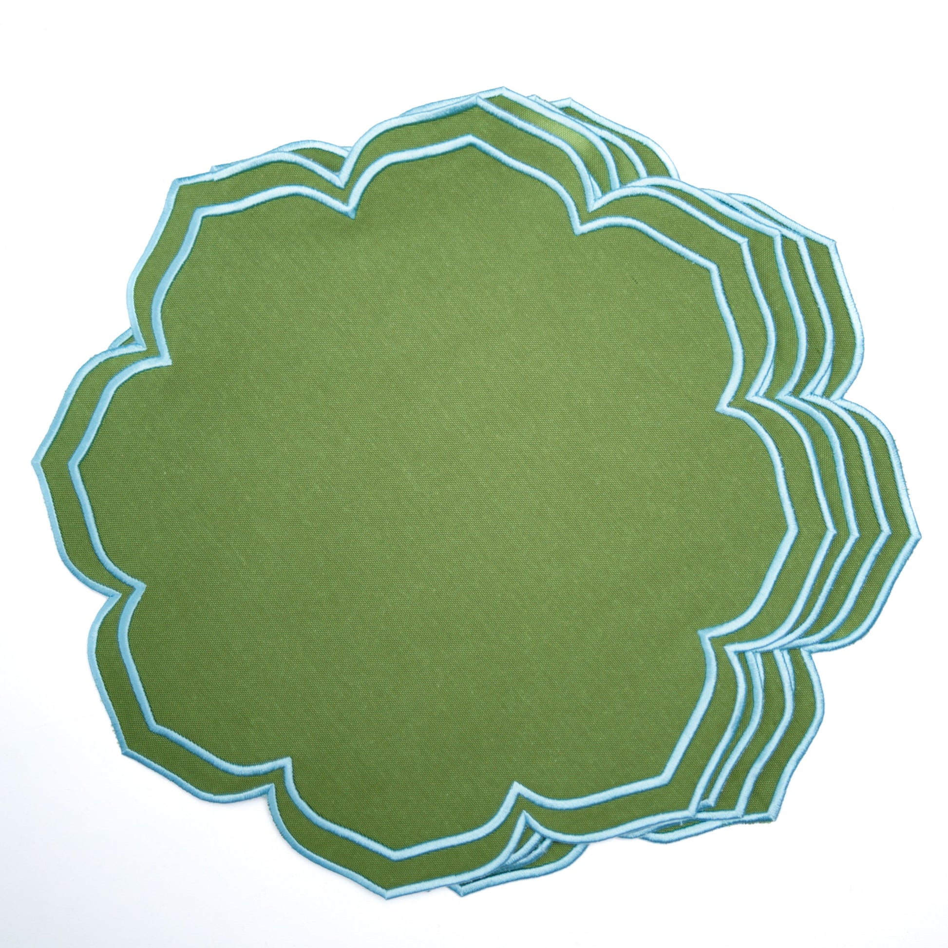 Stack of green paper with white geometric border on a white background