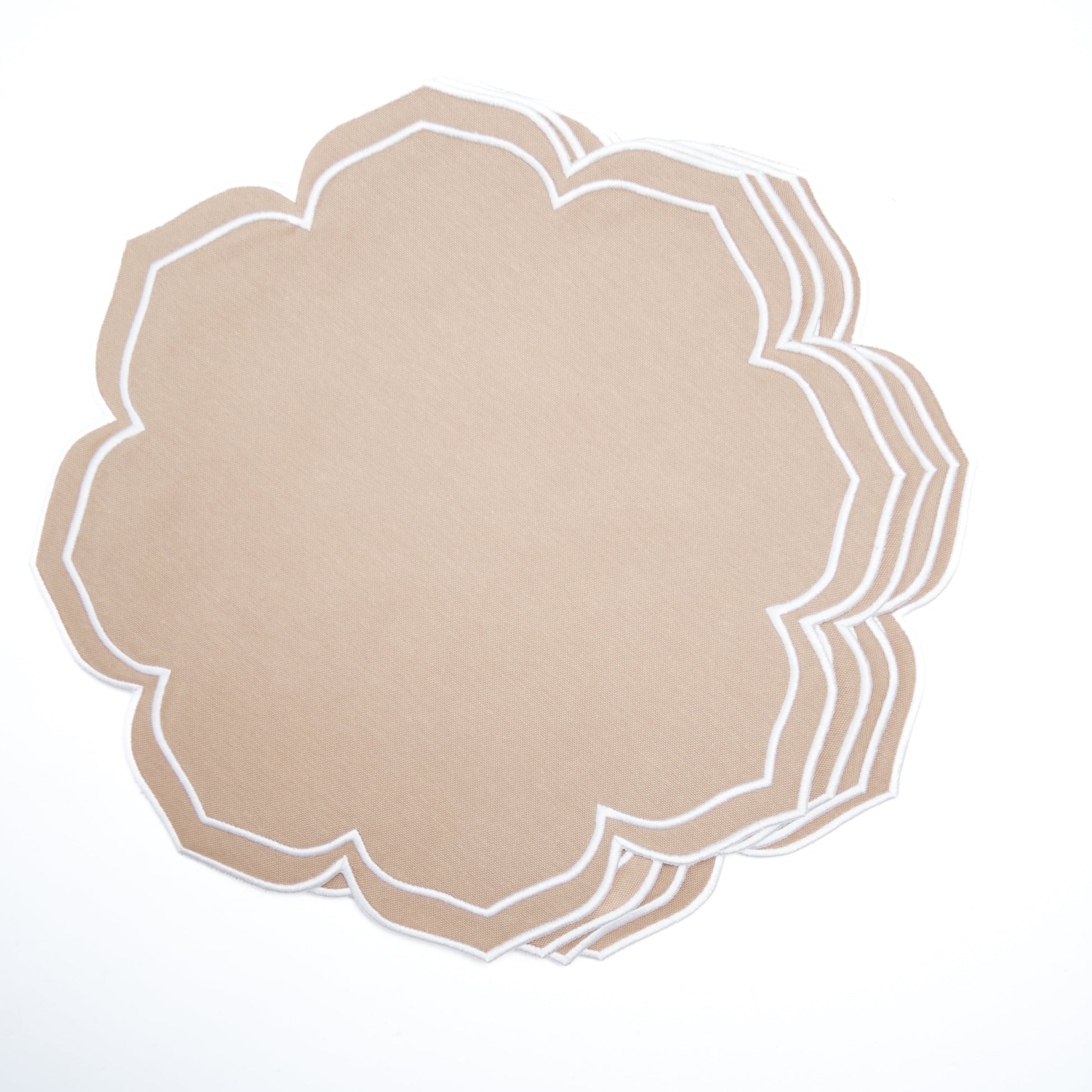 Decorative beige placemat with white scalloped edge on a light gray background