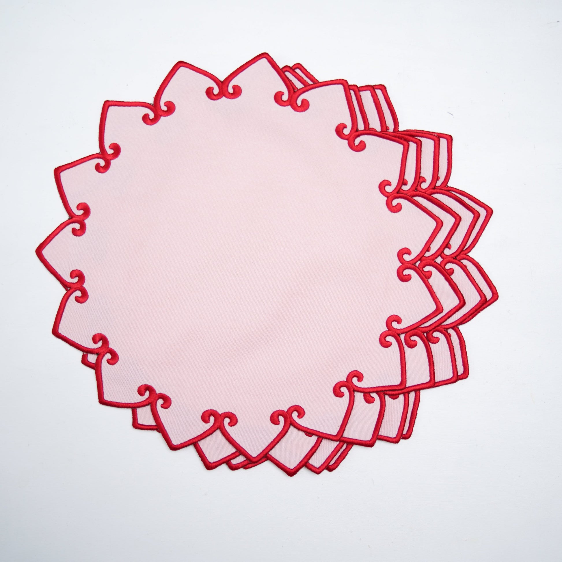 Decorative red circular design on a white background