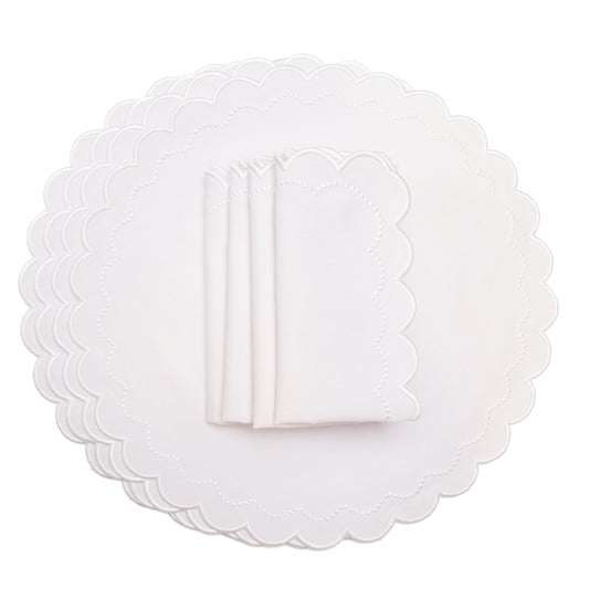 White scalloped placemats on a white background