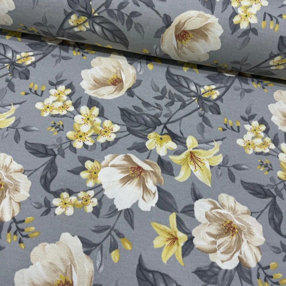 A gray and yellow floral patterned tablecloth.