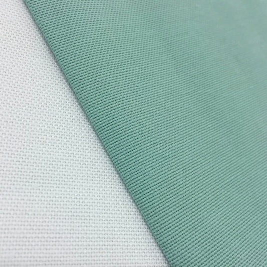 Close-up view of a blue rectangular tablecloth with a textured fabric finish.