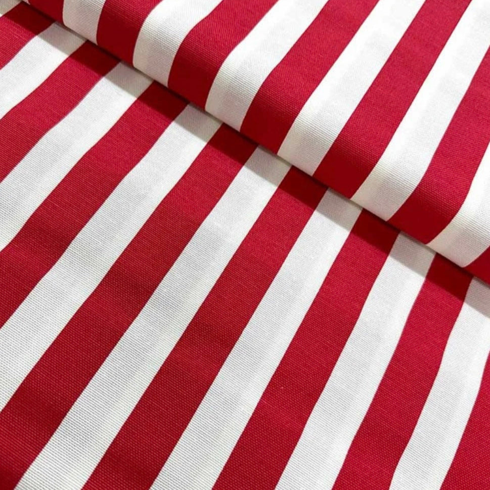 Close-up view of a folded red and white striped tablecloth.