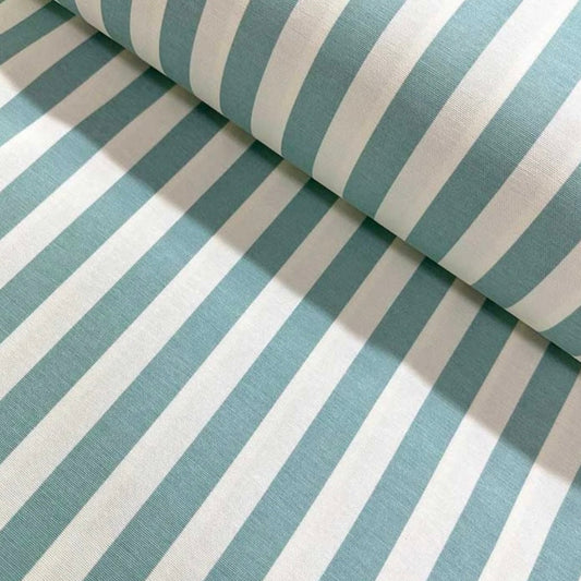Close-up of a folded striped tablecloth in black and white, showcasing the fabric's texture and the stripe pattern.