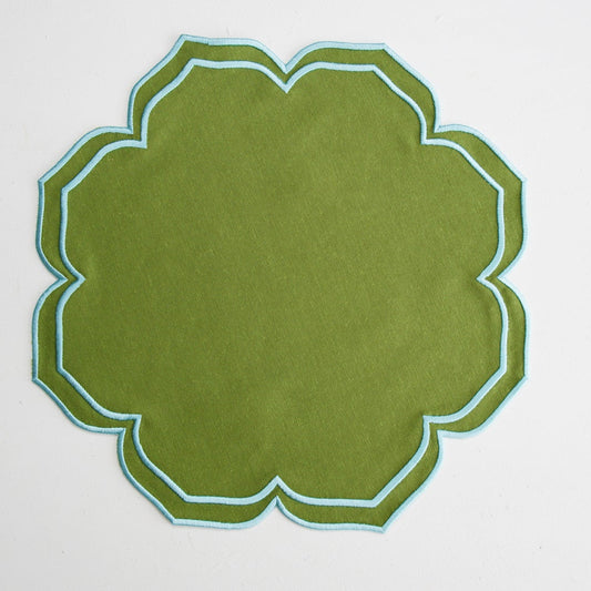 Green decorative item with a geometric pattern on a white background