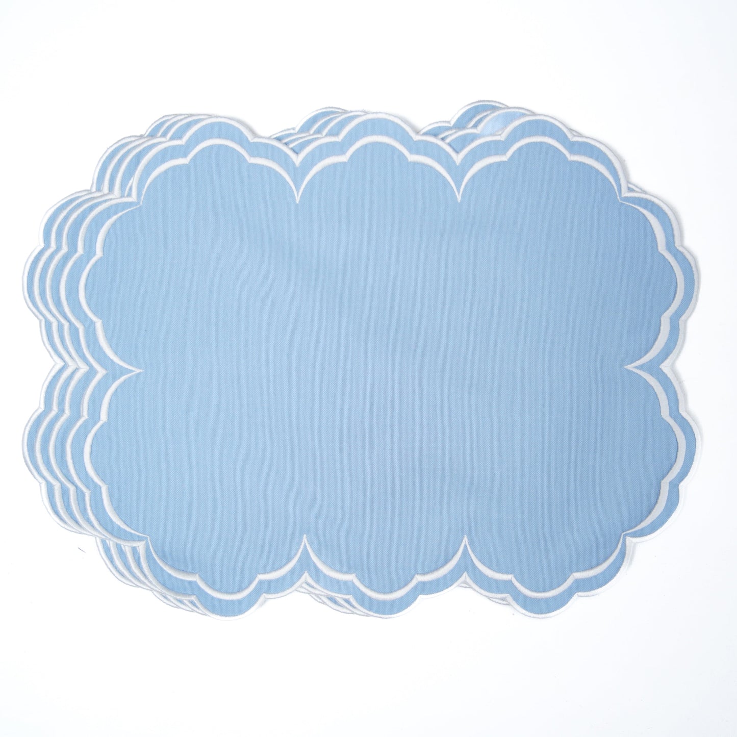 Set of blue paper doilies on a white background