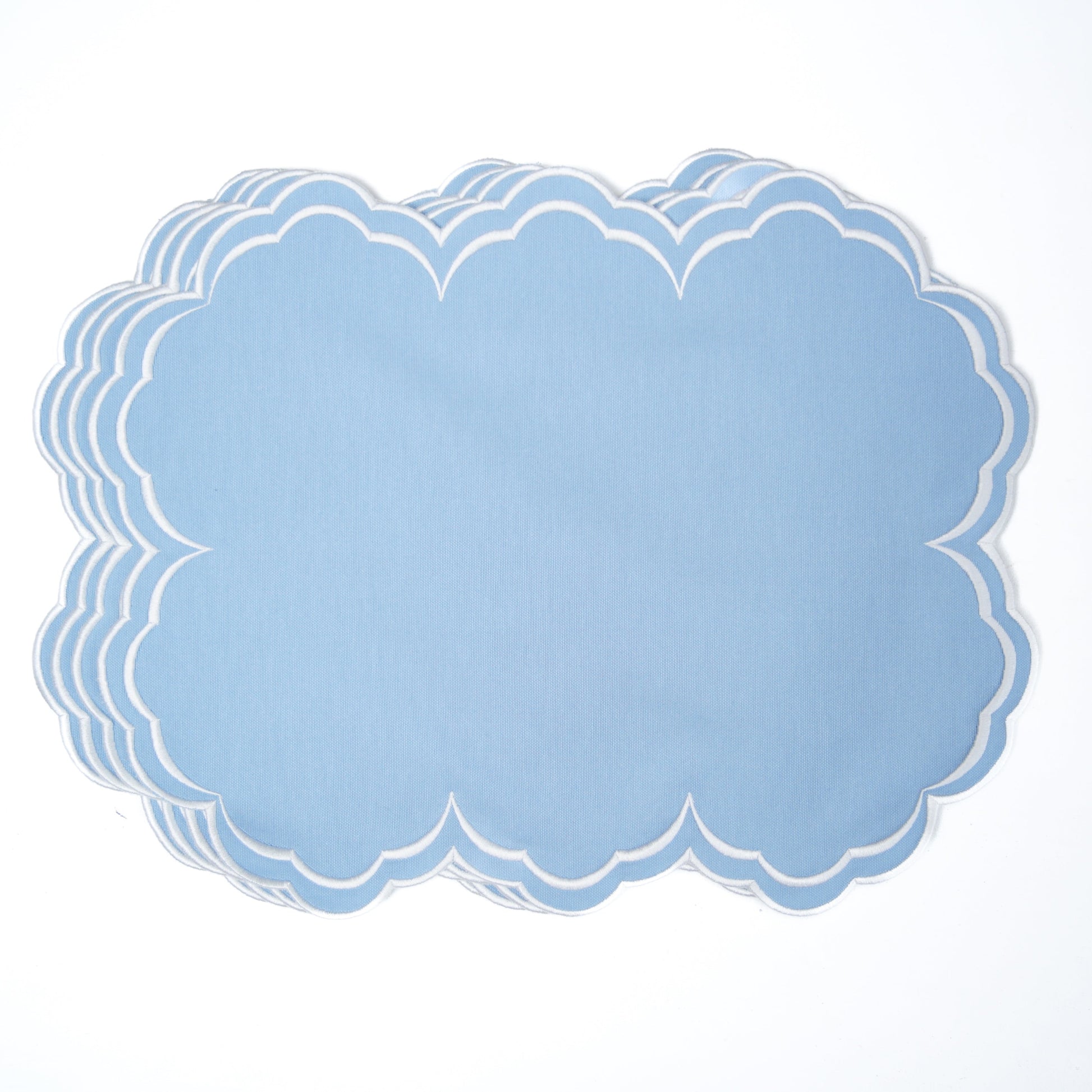 Set of blue paper doilies on a white background