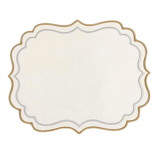 A white fabric placemat with gold embroidered trim, displayed on a plain background.