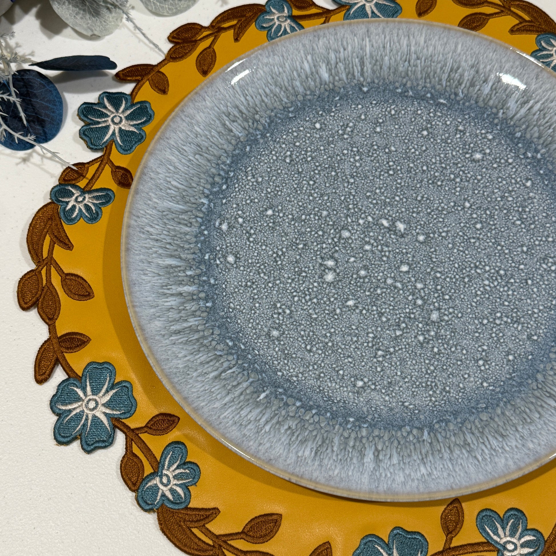 Decorative plate with floral design on a plain background