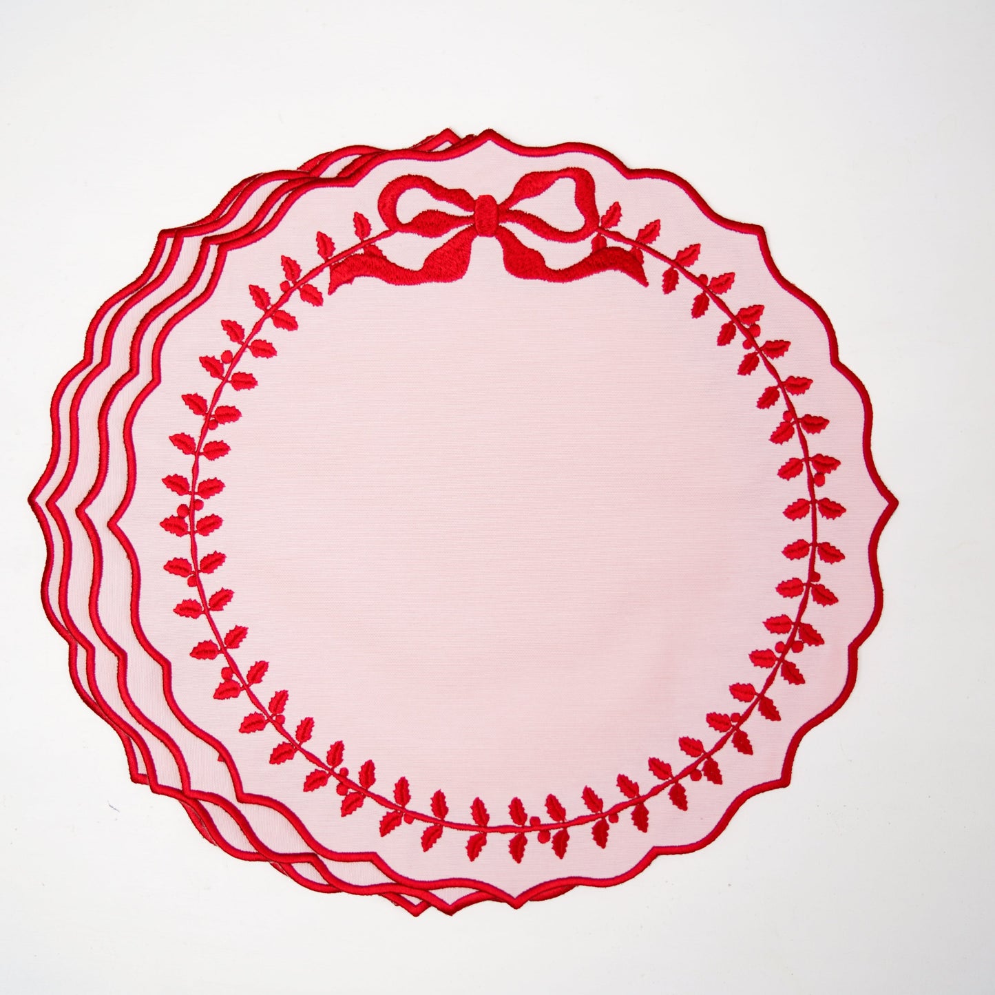 Decorative red plate with a bow on a white background