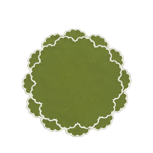 Green circular placemat with scalloped edge on a white background