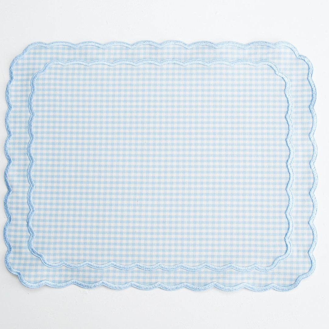 Rectangular blue checkered placemat on a light gray background