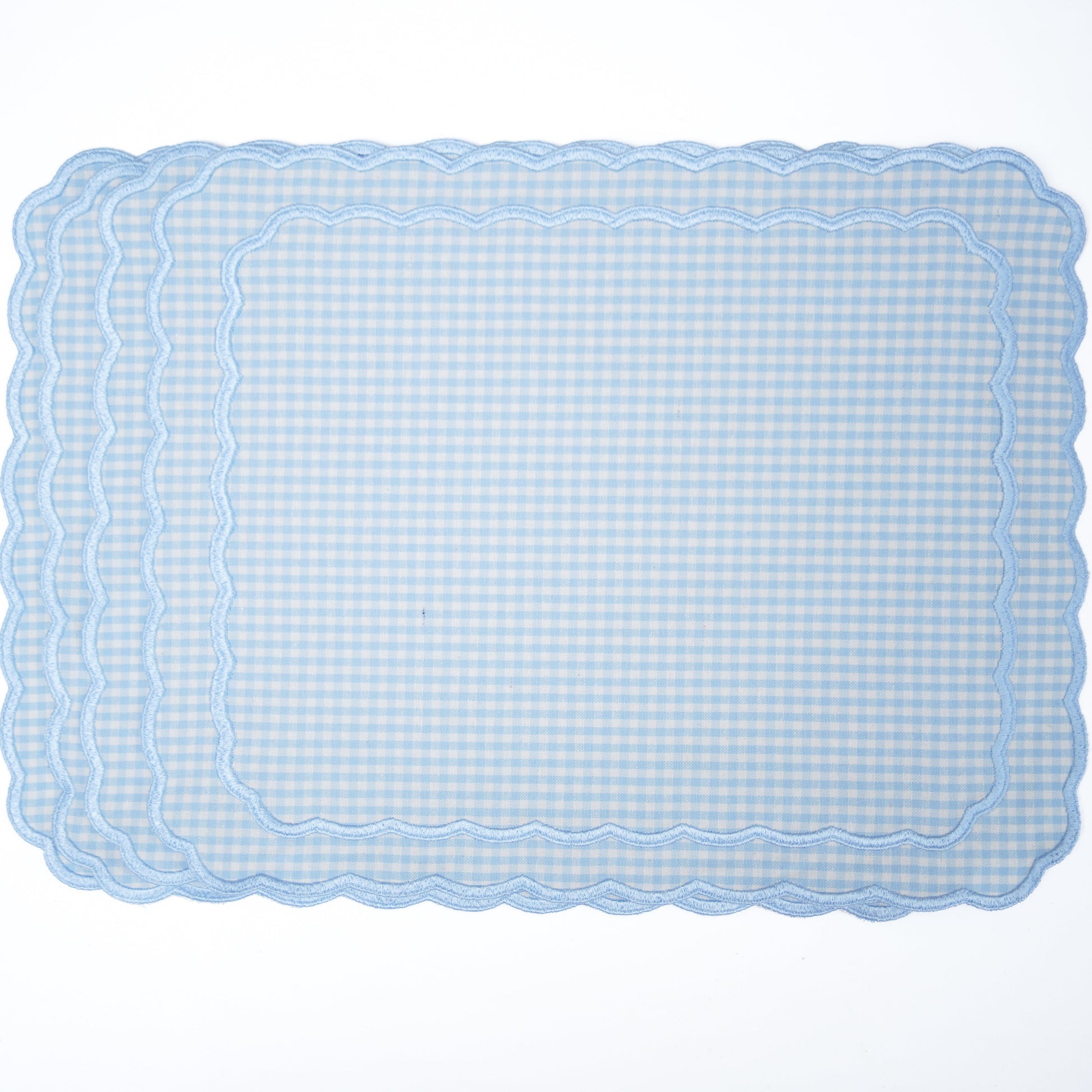 Rectangular blue checkered placemat on a white background