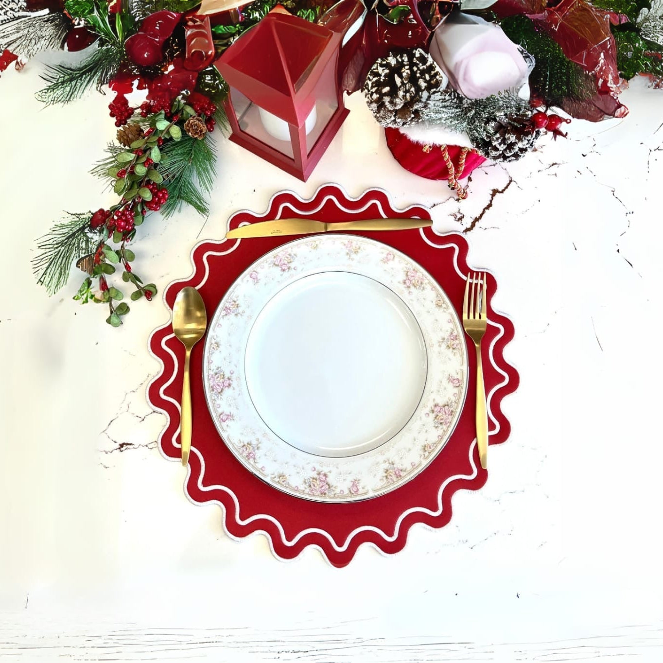 A red faux leather placemat with a decorative edge, presented on a table with a festive centerpiece.