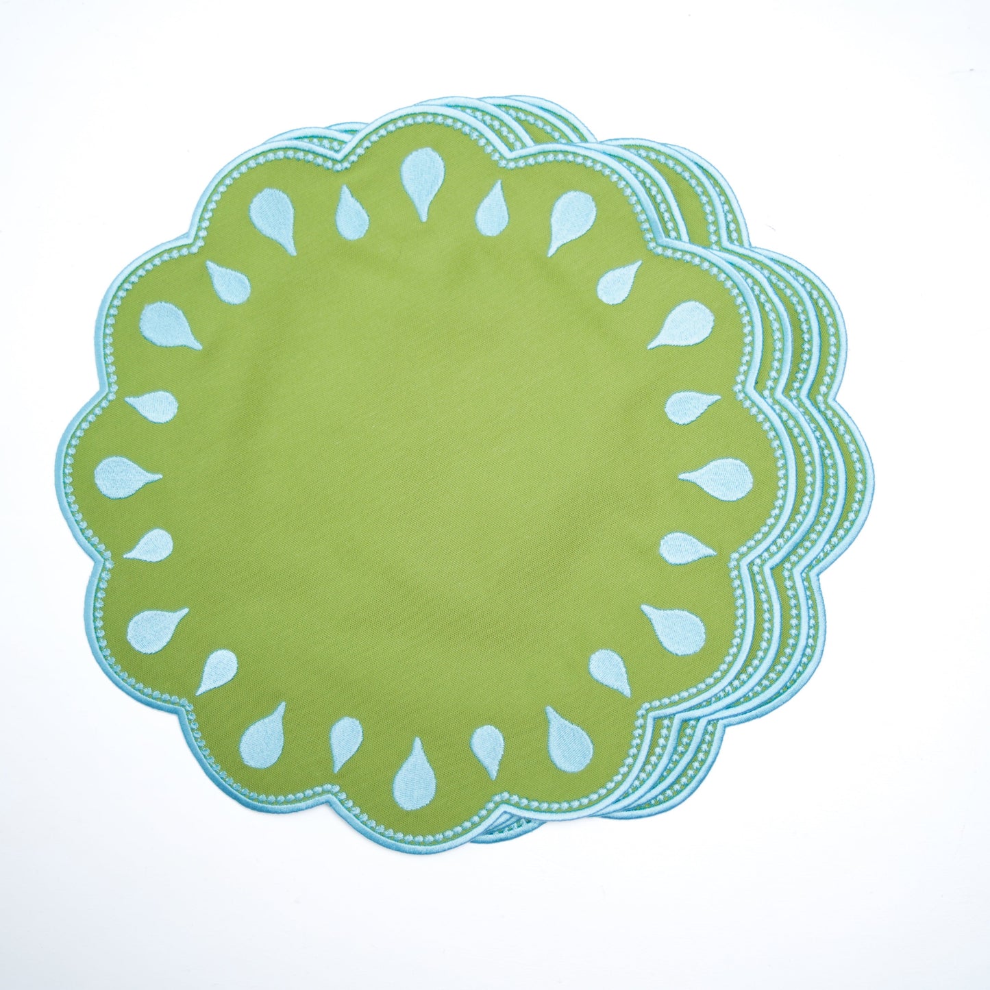 Set of green paper plates with scalloped edge design on a white background