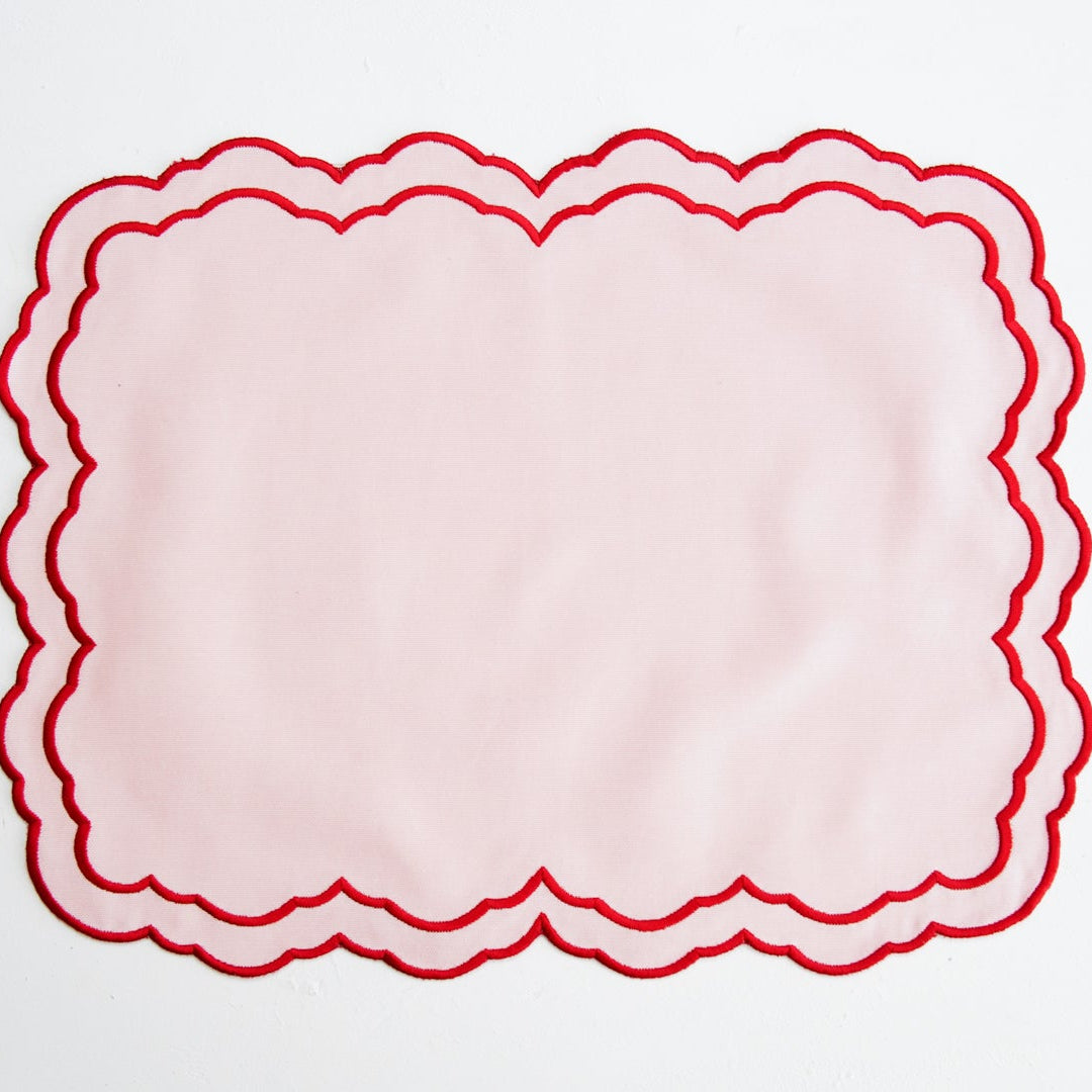 Red scalloped border on a white background