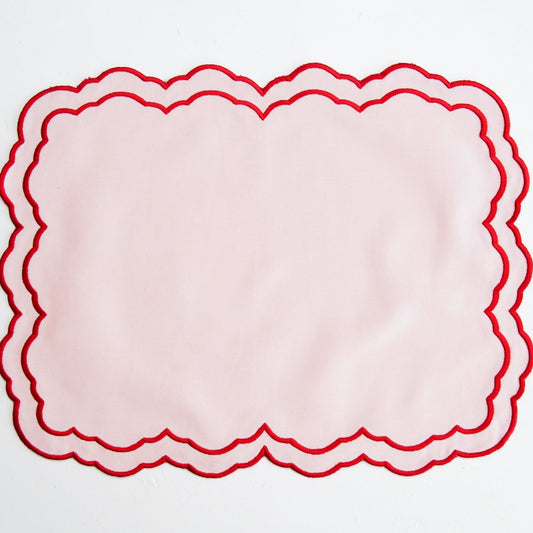 Red scalloped border on a white background