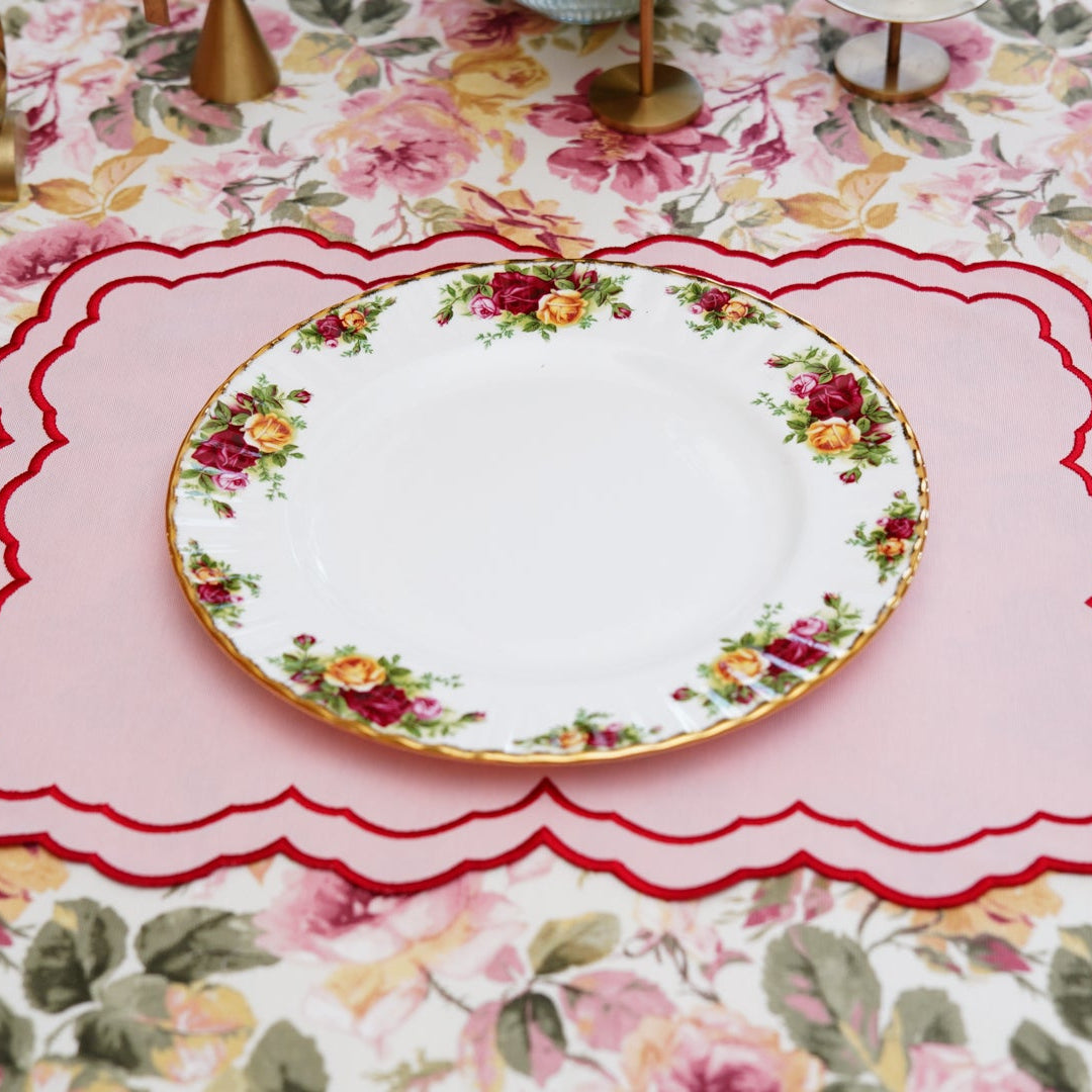 Table setting with floral tablecloth and plate