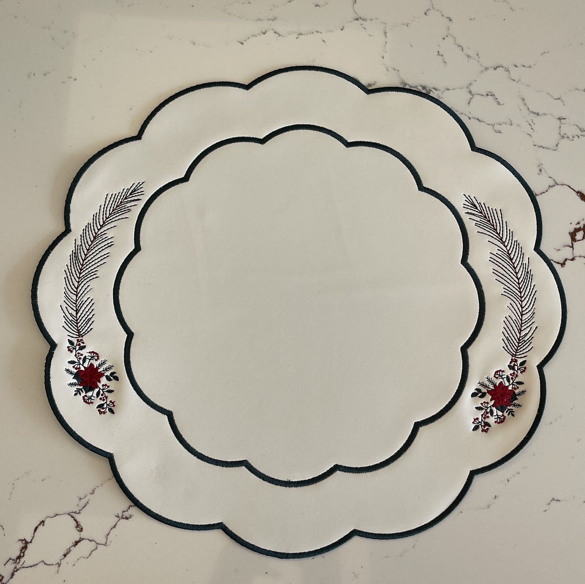 Decorative plate with floral designs on a marble surface