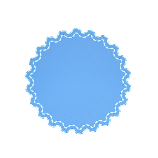 A round light blue faux leather placemat with a textured edge design.