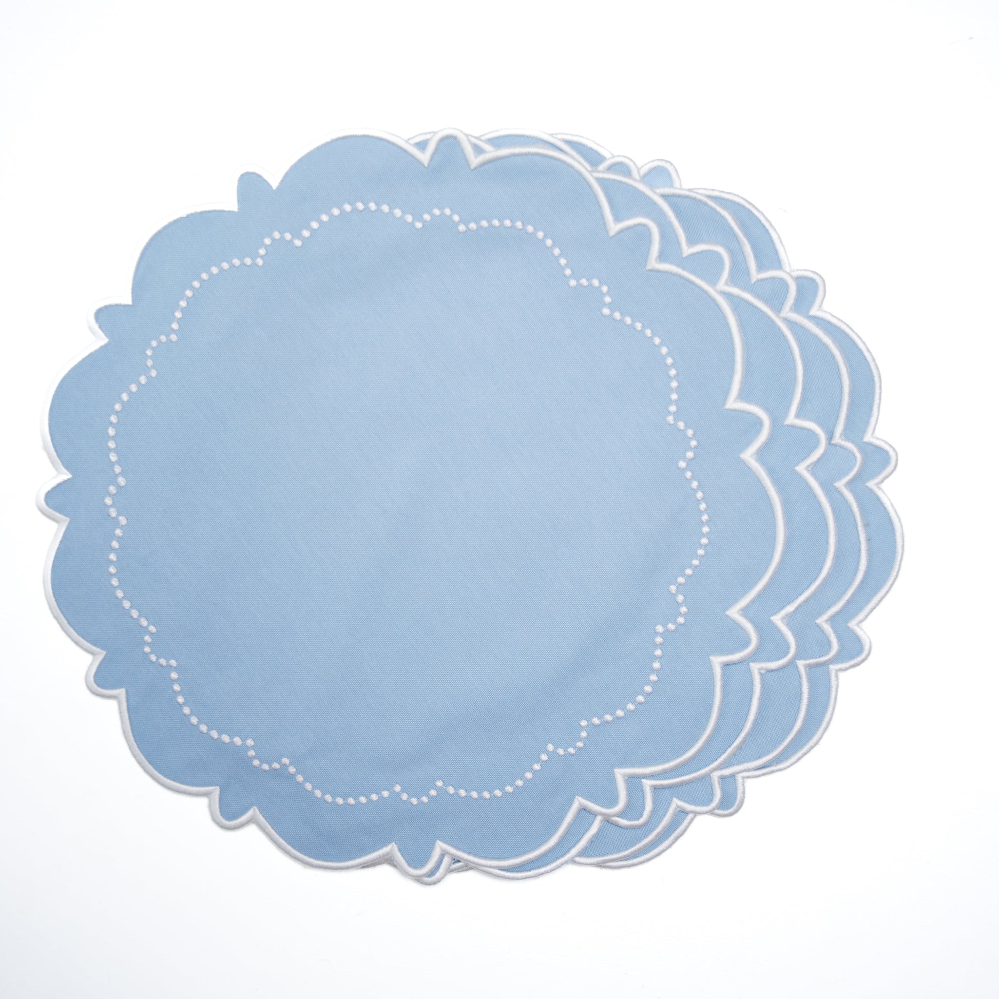 Set of blue lace doilies on a white background
