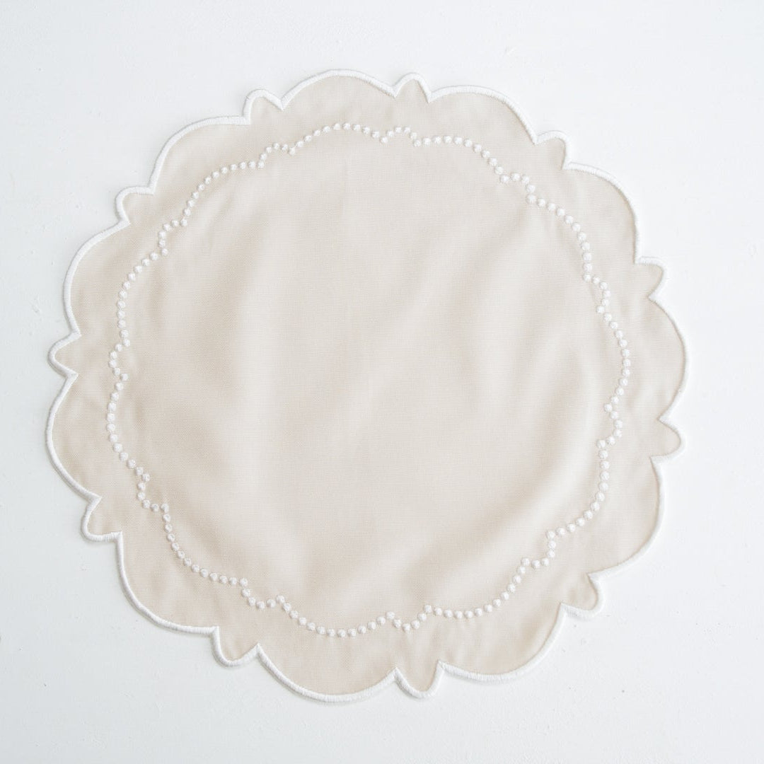 Round lace doily on a white background