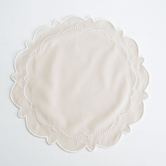 Round lace doily on a white background