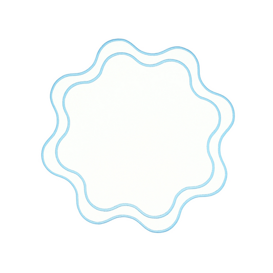 A round placemat with a white and blue faux leather design.