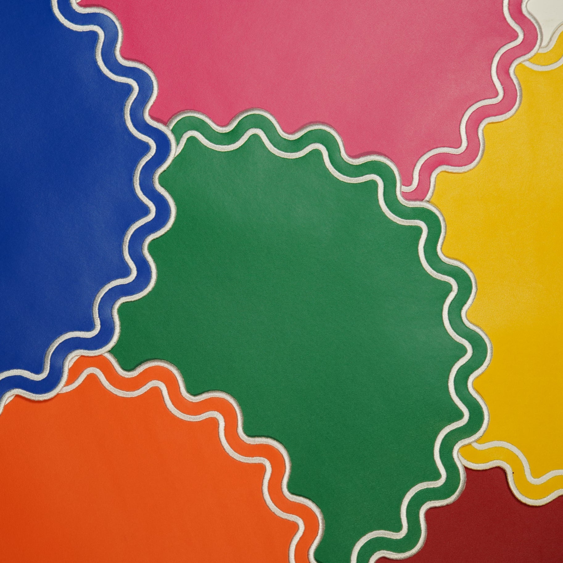 Colorful circular shapes with wavy edges on a multicolored background