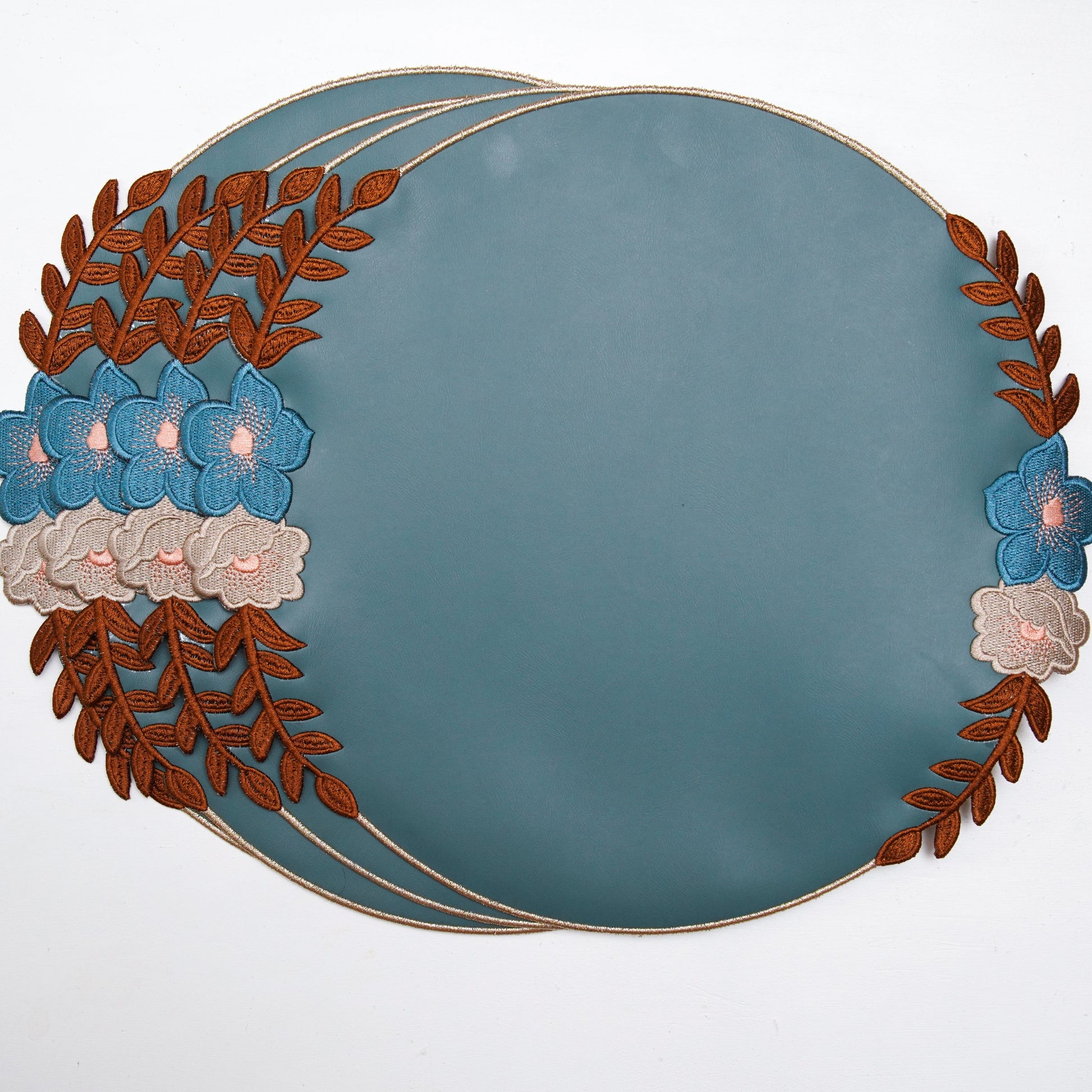 Decorative plate with floral and leaf design on a white background