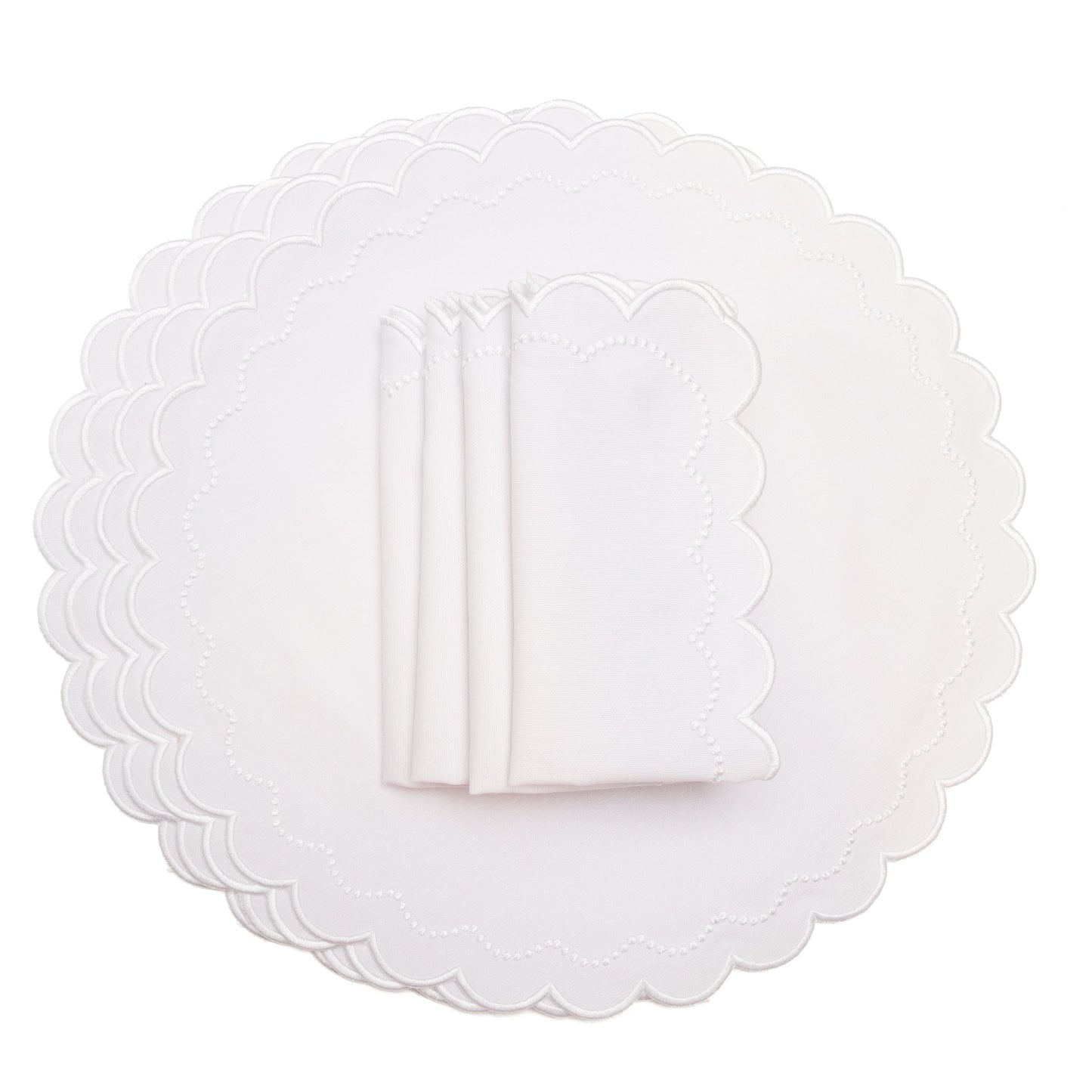 White scalloped placemats on a white background