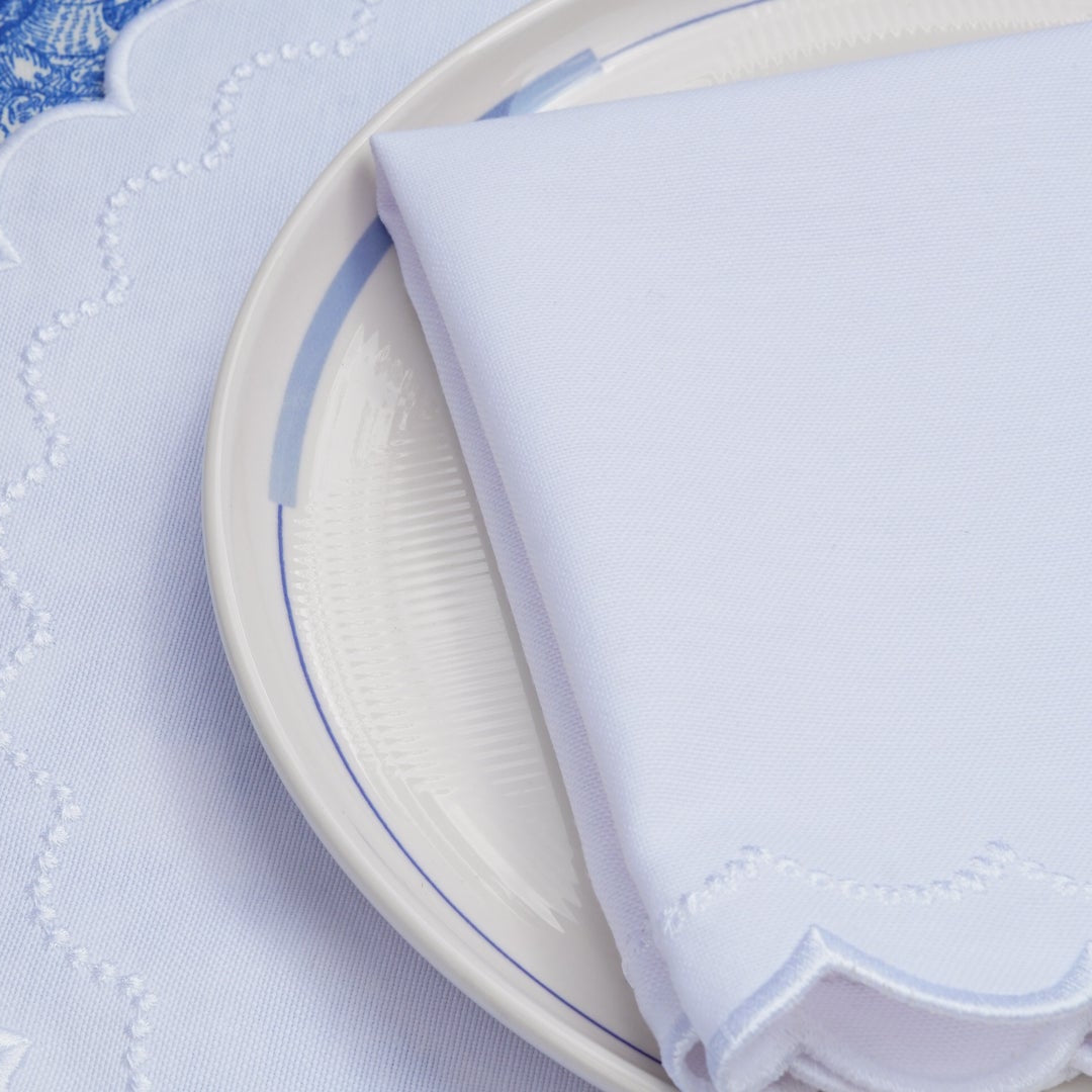 Close-up of a table setting with blue and white decor