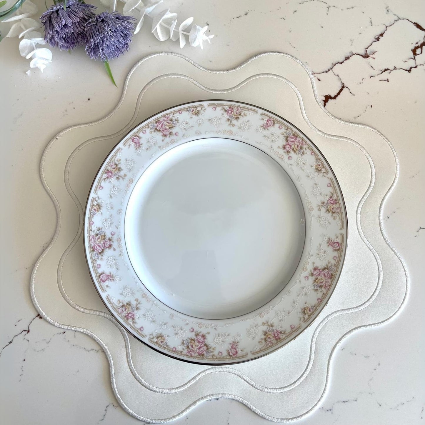Decorative plate with floral pattern on a marble surface