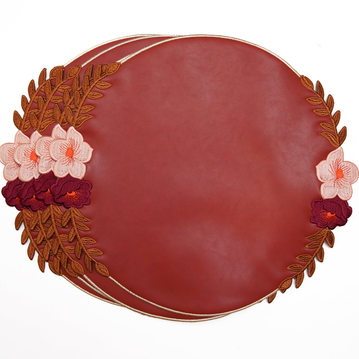 Decorative red plate with floral designs on a white background