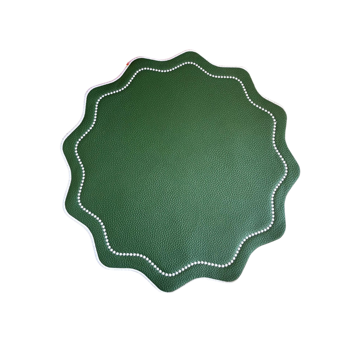 A round green faux leather placemat with a scalloped edge and white stitching detail around the border.