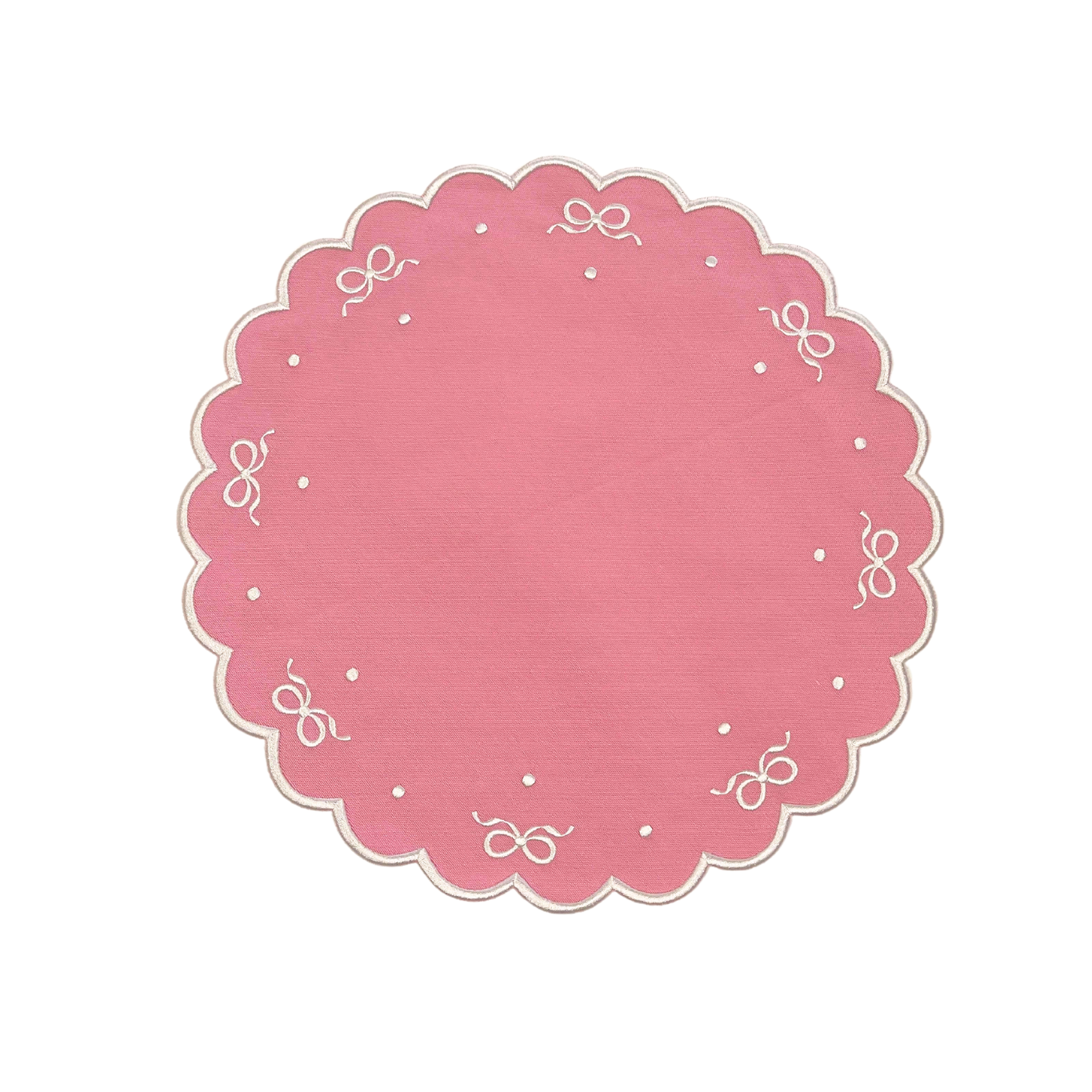 A round pink fabric placemat with embroidered detailing around the edge, displayed on a white background.