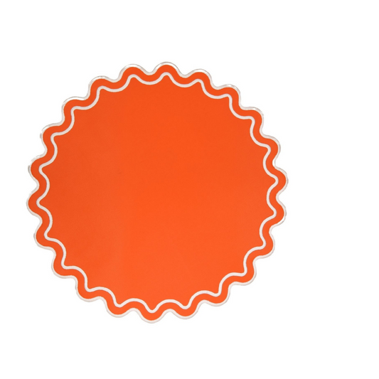 A single orange faux leather placemat with a scalloped edge design.