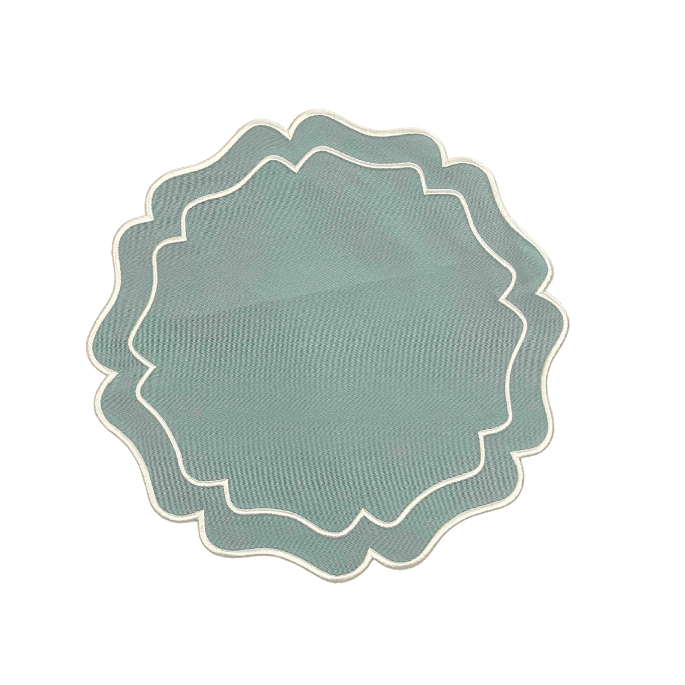 A round green embroidered placemat with a white border laid out on a white background.
