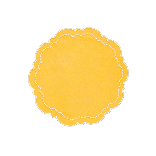 A yellow fabric placemat with scalloped edges on a white background.