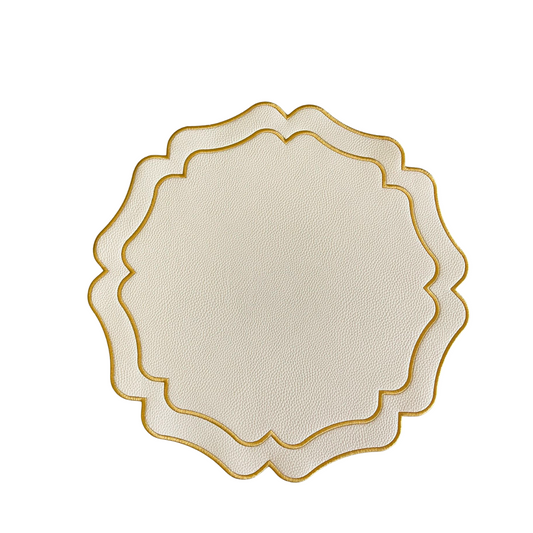 A round placemat with ivory faux leather texture and gold-colored trim, designed for use at dining tables.