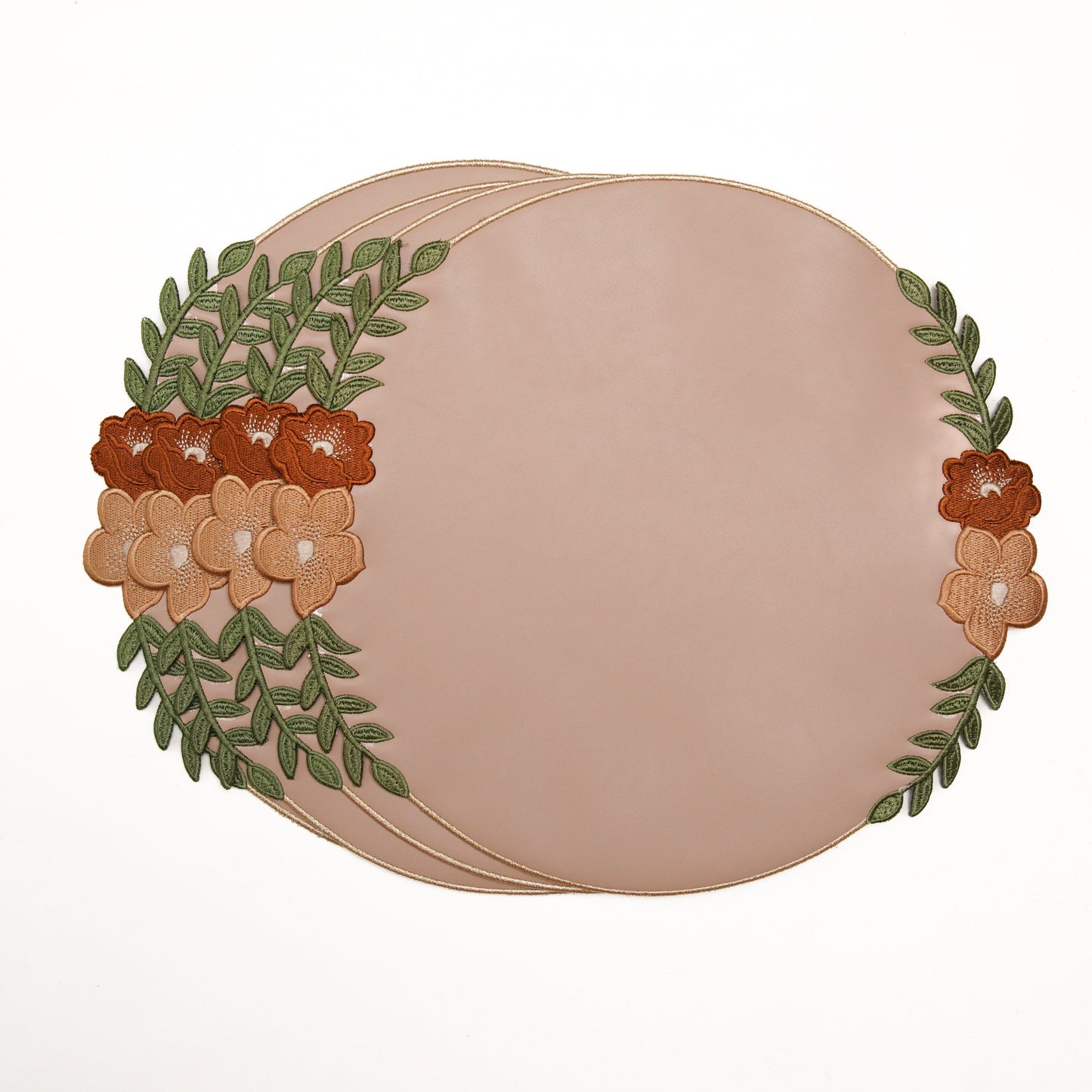Round beige placemat with floral and leaf design on a white background