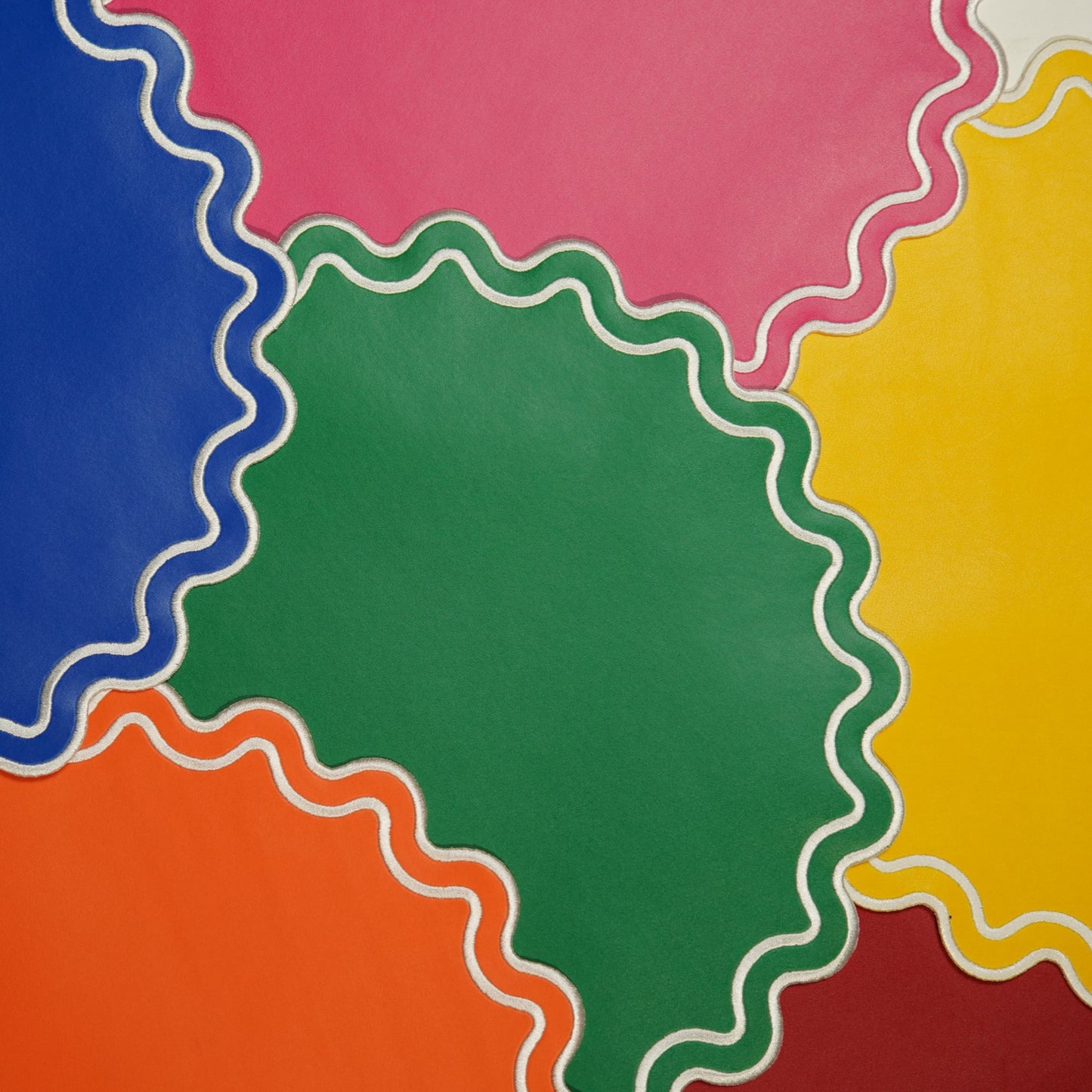 Colorful circular shapes with wavy edges on a multicolored background